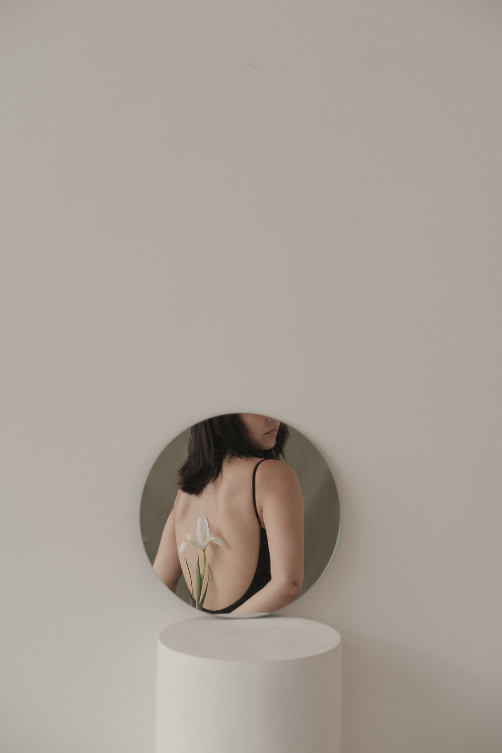 Woman as Seen on Round Mirror