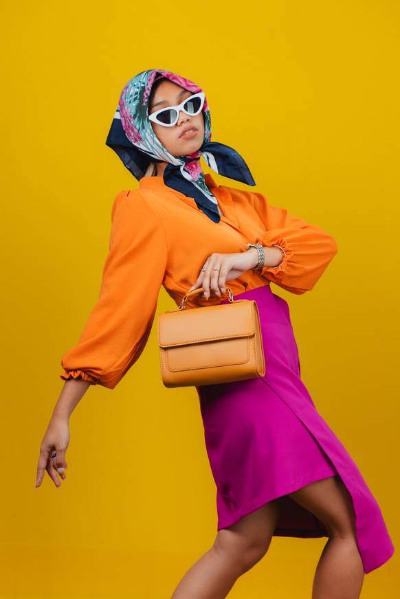 Stylish Woman with Headscarf, Sunglasses, and Bag  